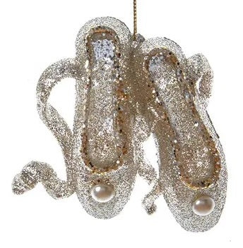 Glitter ornaments shaped like a pair of ballerina shoes.