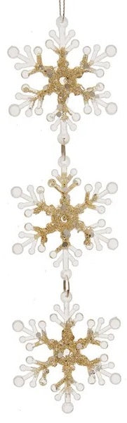 Hanging ornaments shaped like snowflakes.