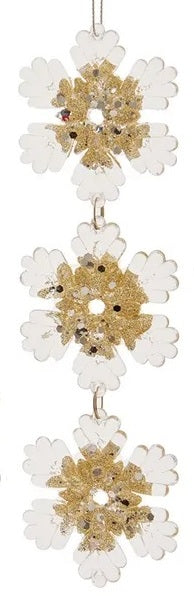 Hanging ornaments shaped like snowflakes.