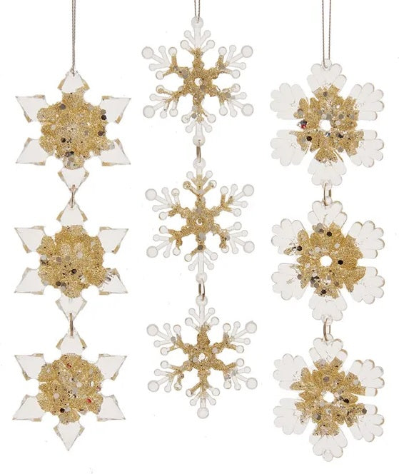Hanging ornaments shaped like snowflakes.