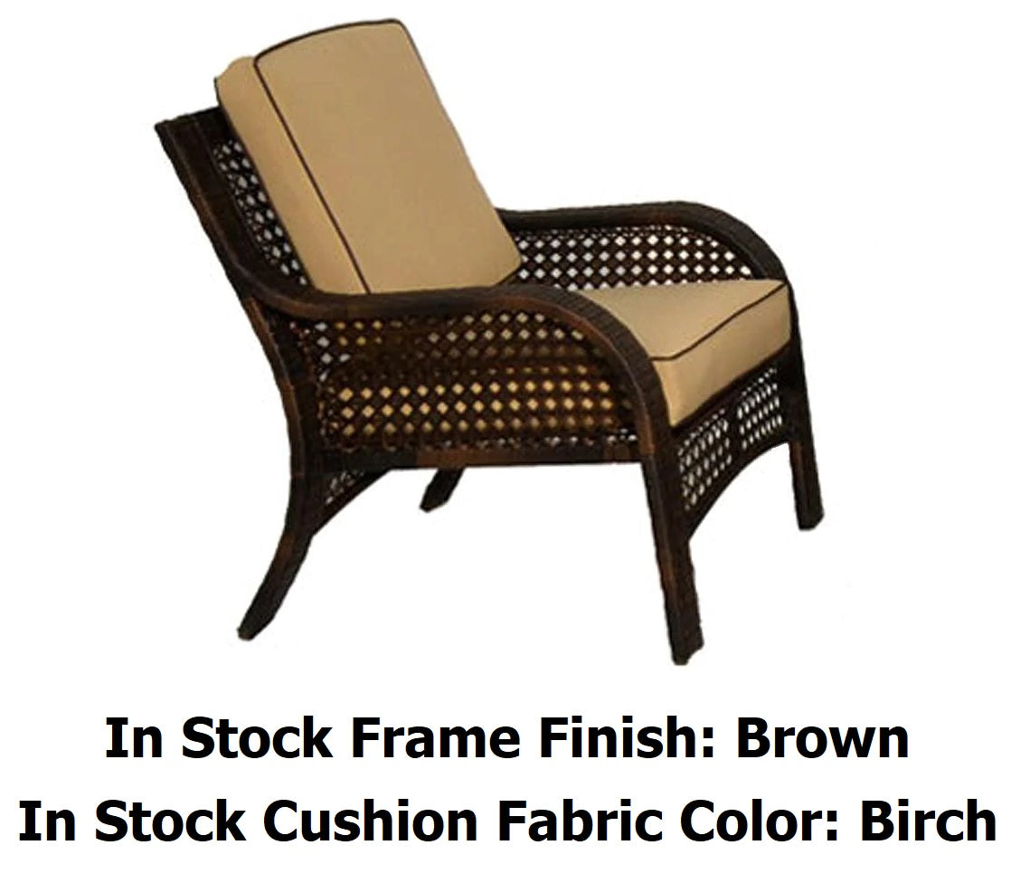 Patio furniture set on a stone patio. The frames are dark brown and the cushions are an orange-ish, tan color.