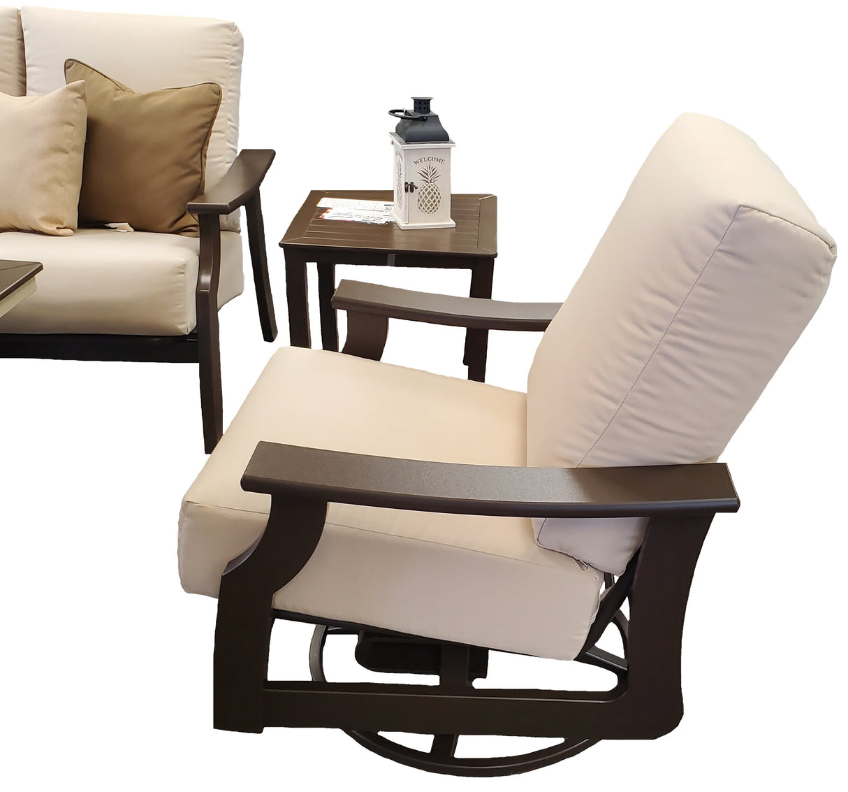 This image shows part of the sofa, the end table and the swivel rocker chair on a white background.