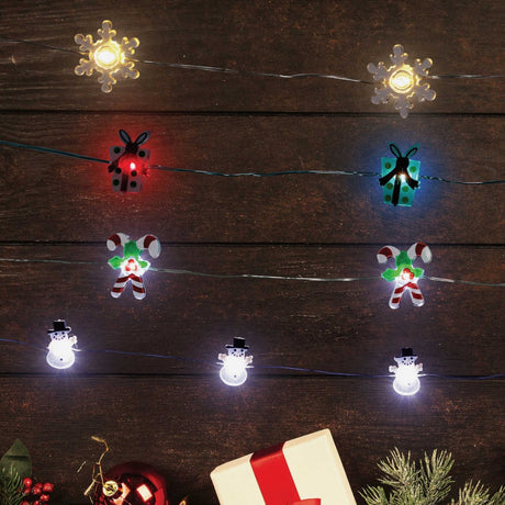 This image shows the different light strings against a wooden background. One option features warm white lighted snowflakes. One option features red and blue lighted presents. One option features pure white lighted snowmen wearing top hats.