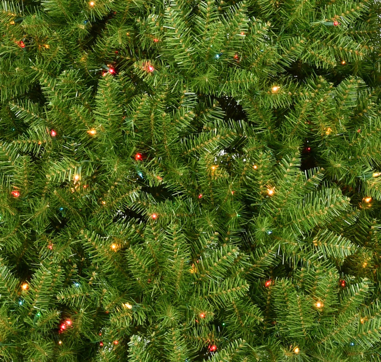 Artificial tree pre-lit with multi-colored lights.