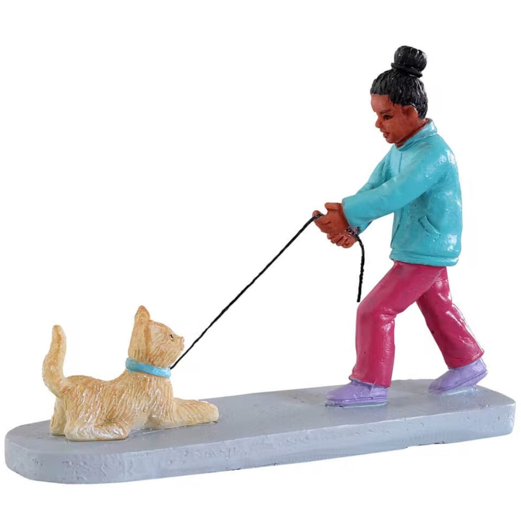 Resin figure for a Lemax display. Designed to look like a young girl trying to walk a cat. She's struggling with the leash.