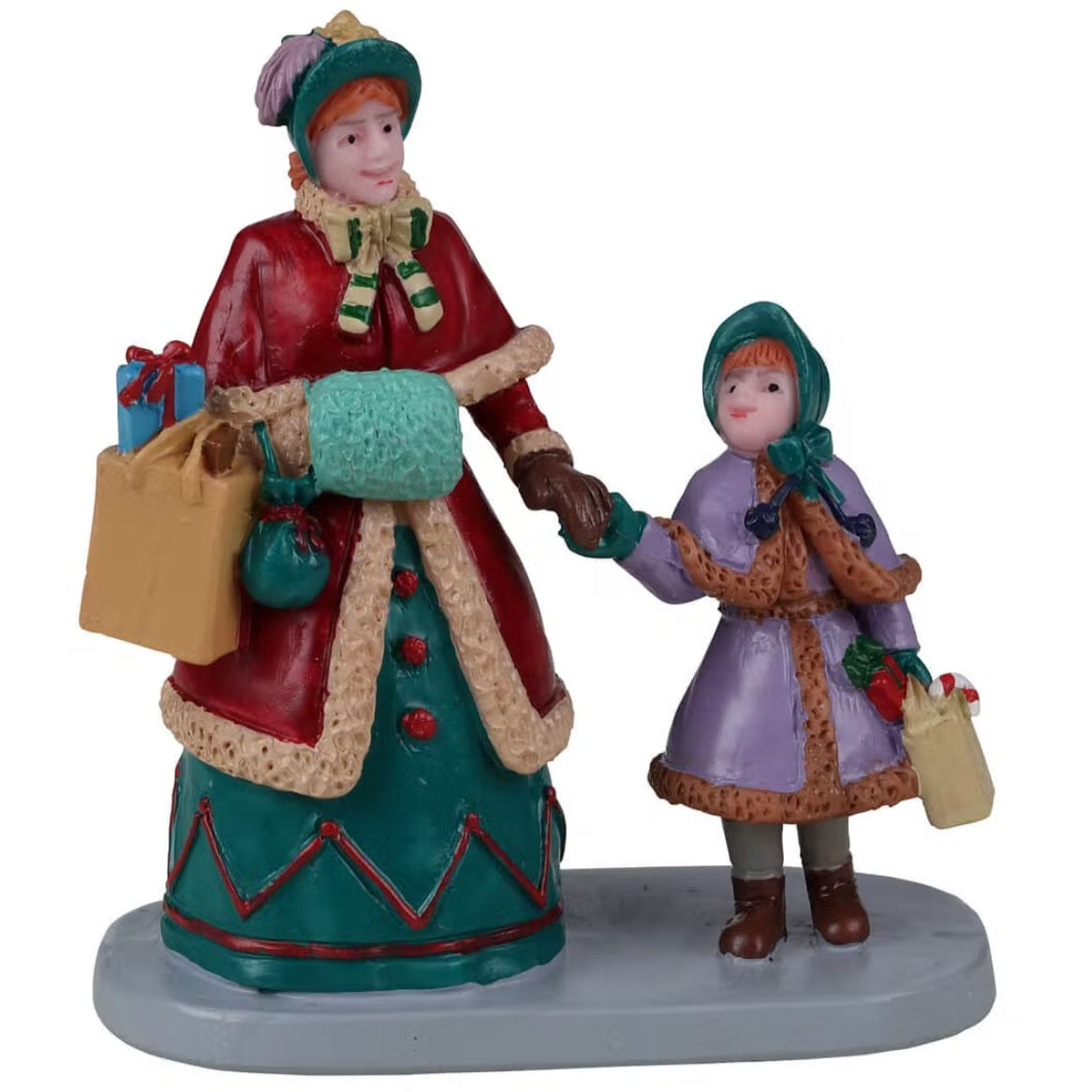 Resin figurine for a Lemax display. Designed to look like a mom holding her young daughter's hand. They're both wearing older Victorian-type clothes and holding shopping bags.