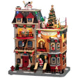 Resin lighted building for a Lemax display. Designed to look like a large, brick apartment complex that's decorated for Christmas. There are elves hanging out of the windows and standing on balconies. There are snowmen, reindeer and a decorated Christmas tree on the roof. Santa is waving from the stairs and there's a dog wearing a Santa hat on the sidewalk.