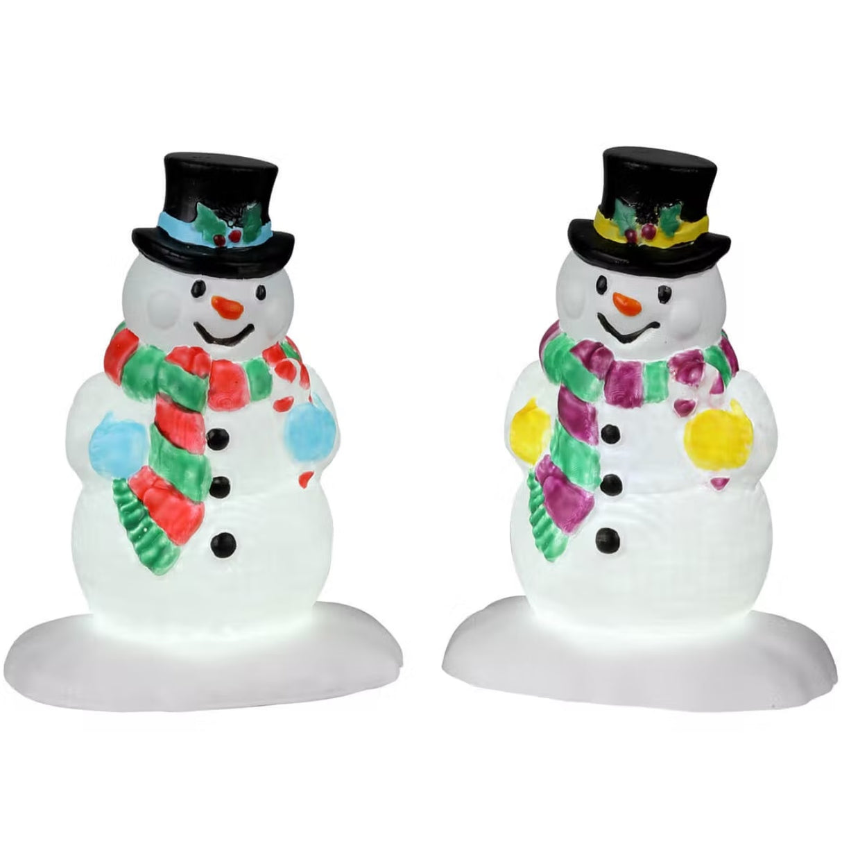 Plastic village accessories for a Lemax display. Designed to look like two snowmen. One snowman is wearing a red and green striped scarf and blue mittens. The other is wearing a purple and green striped scarf and yellow mittens. They're both wearing top hats with holly leaves and berries on them.