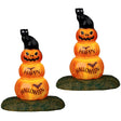 Resin village accents for a Spooky Town Lemax display. Designed to look like two stacks of three pumpkins. The top pumpkin is a jack-o-lantern. The second pumpkin reads "HAPPY" and has a bat on it. The third pumpkin reads "HALLOWEEN" and has a bat on it. The pumpkins are stacked on top of each other like a snowman.