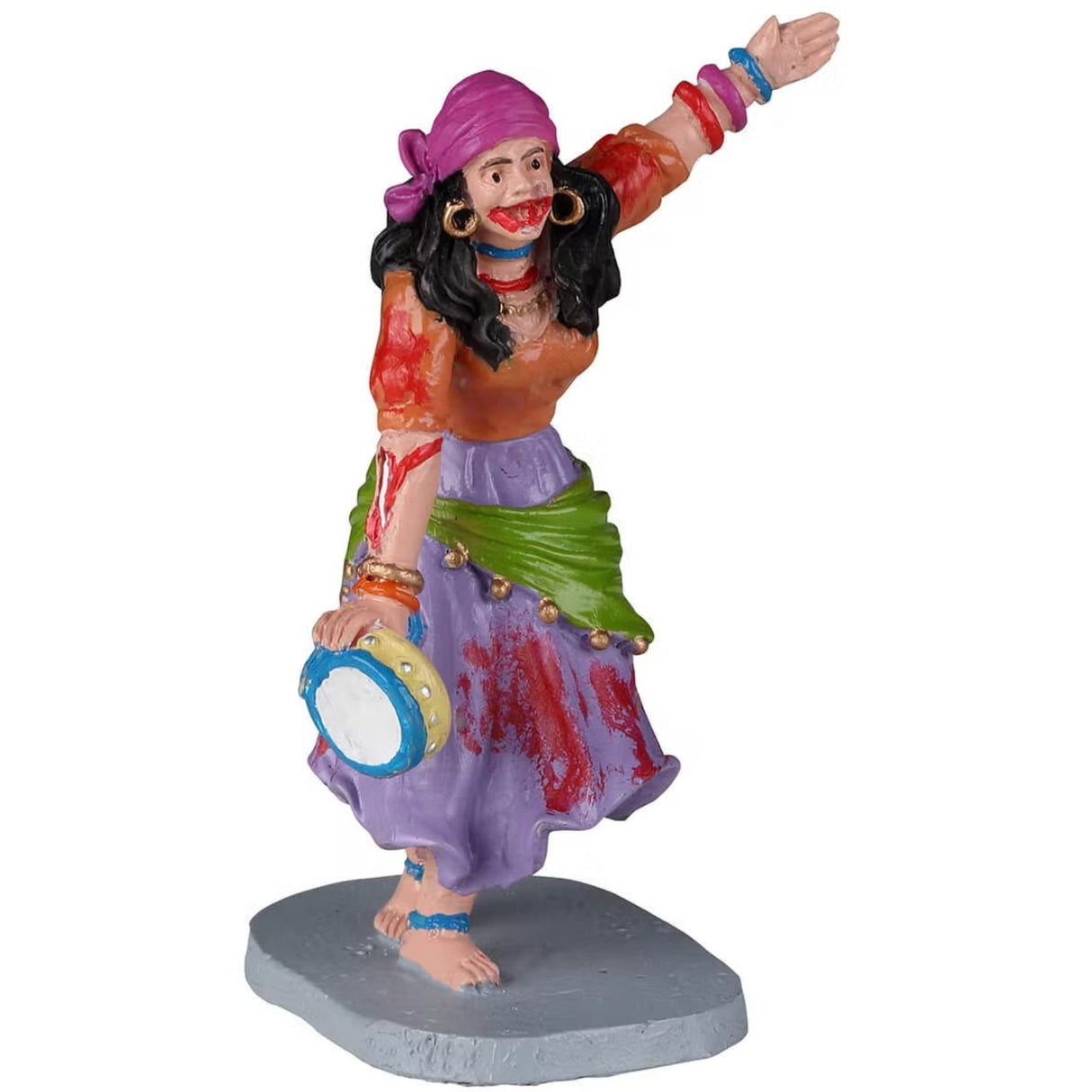 Resin figurine for a Lemax display. Designed to look like a woman wearing a dark pink bandana, gold hoop earrings, an orange shirt, a purple skirt and a green skirt cover with gold jingle bells. She's wearing necklaces and bracelets and ankle bracelets and is playing a tamborine.