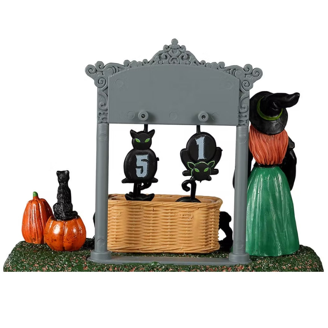 Resin village accent for a Spooky Town Lemax display. Designed to look like a witch holding a broom and a wand standing next to a Halloween countdown. The sign reads "Days 'Til Halloween" and there are removable numbers hanging off of it. There's a basket on the grass holding all the other numbers. There are black cats and jack-o-lantern accents.