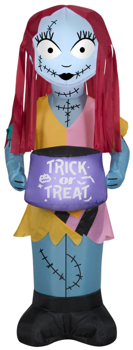 Halloween inflatable shaped like Sally the doll from the movie The Nightmare Before Christmas. She's holding a bag that reads "Trick or Treat."