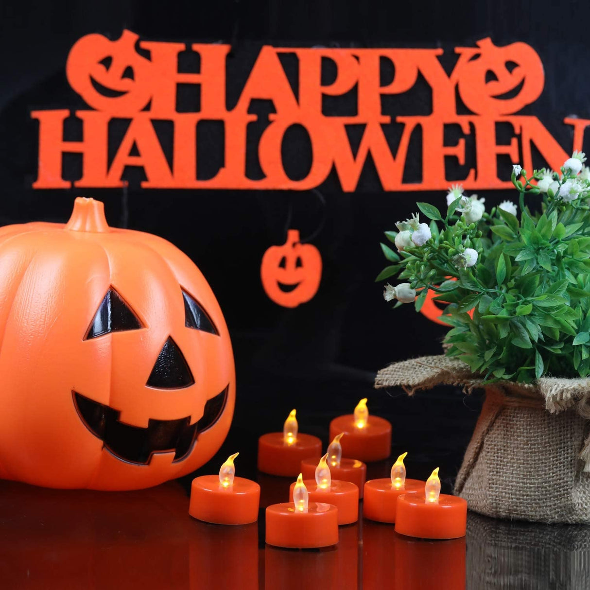 Two orange flameless LED candles.