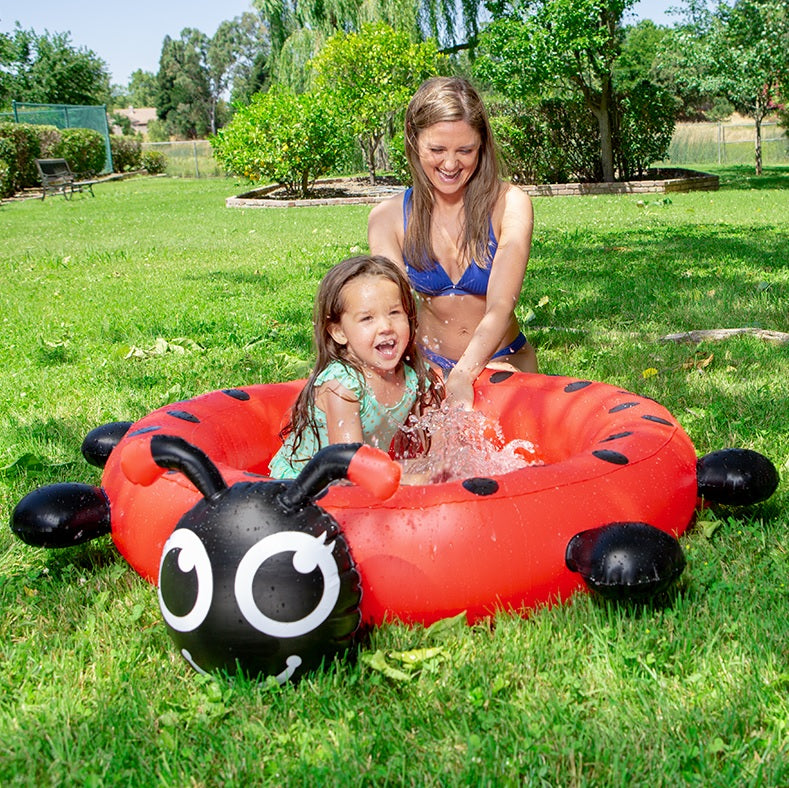 Small inflatable pool for kids shaped like a cute ladybug.