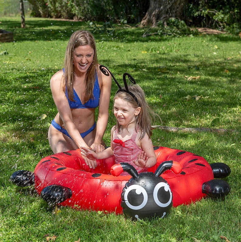 Small inflatable pool for kids shaped like a cute ladybug.