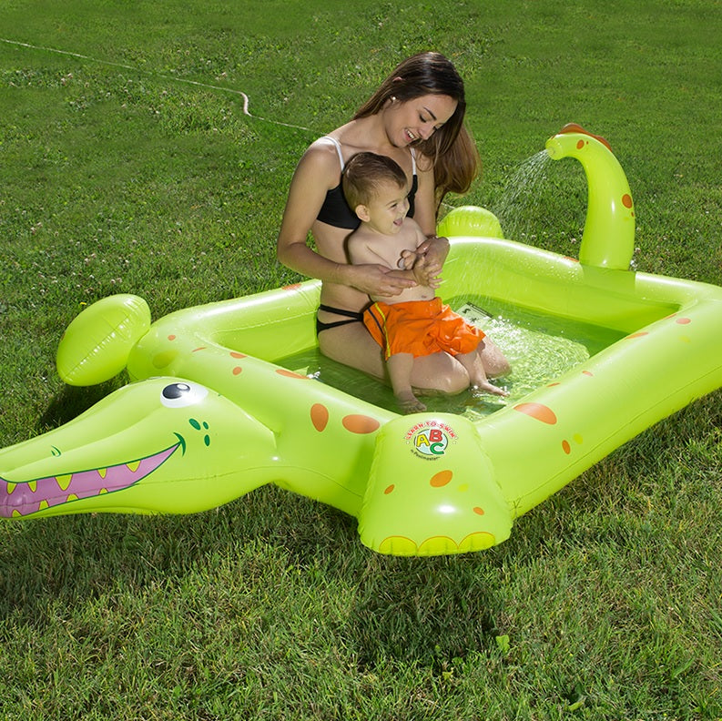 Inflatable pool for kids shaped like a square crocodile.