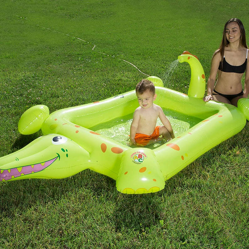 Inflatable pool for kids shaped like a square crocodile.