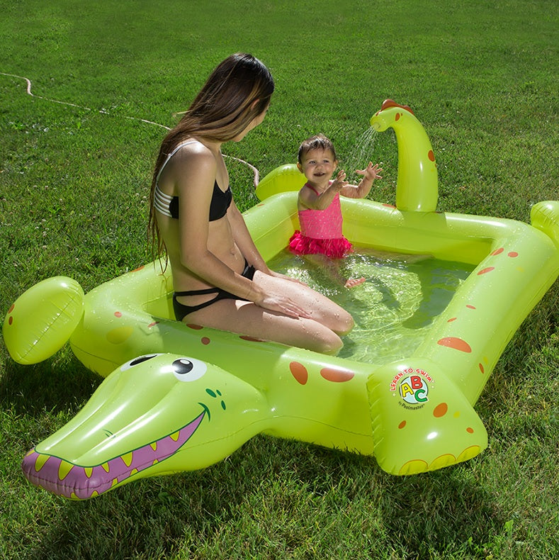 Inflatable pool for kids shaped like a square crocodile.