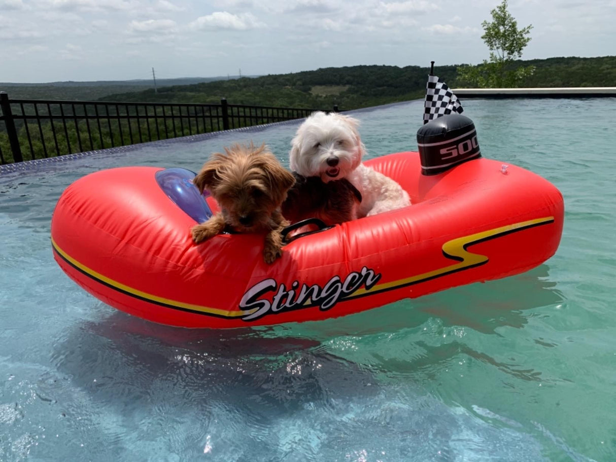 Pool float for kids shaped like a red speedboat.
