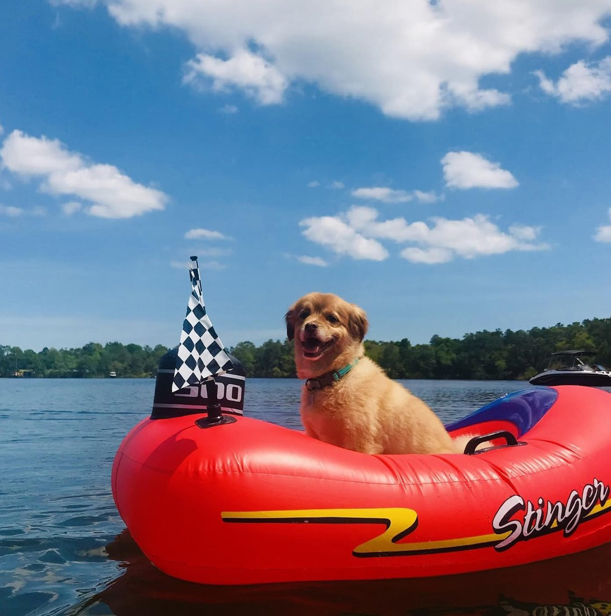 Pool float for kids shaped like a red speedboat.