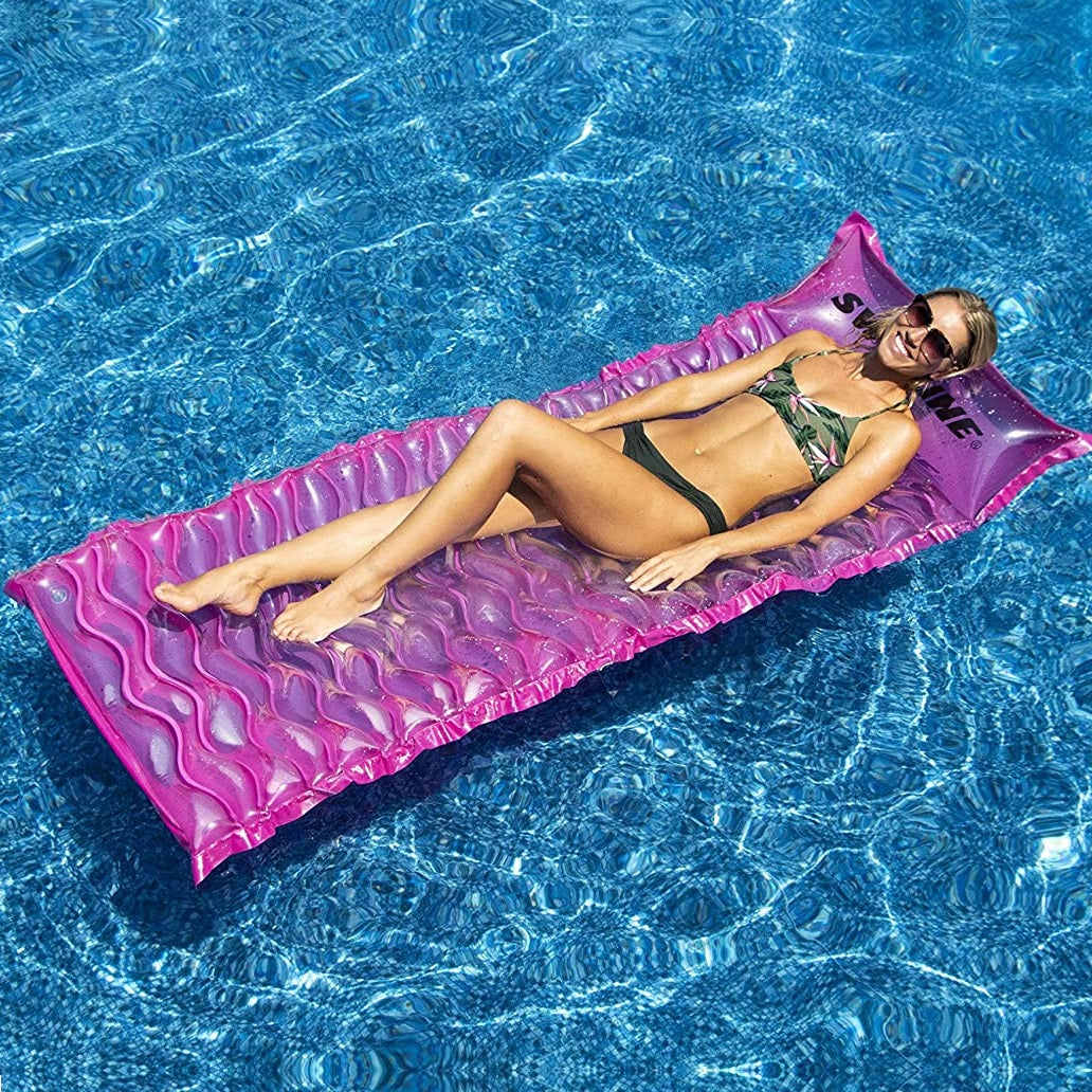 Pink inflatable pool mattress.