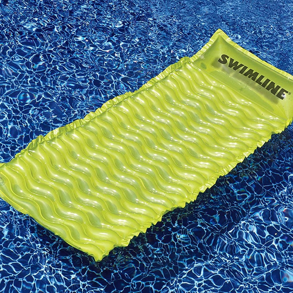 Inflatable pool mattresses. There are three color options: yellow, pink or lime green.