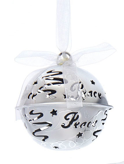 Silver bell ornament with swirl and star cutouts and cutouts that read "PEACE."