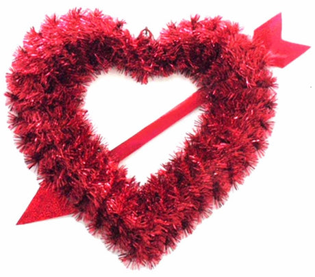 Tinsel wreath shaped like a heart with an arrow through it.