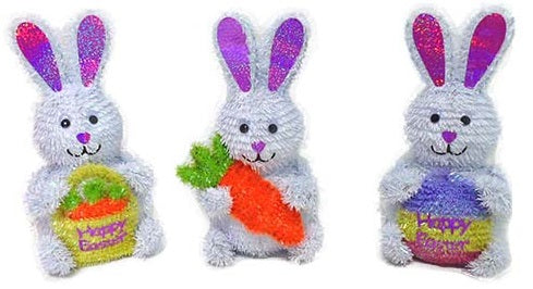Tabletop Easter decorations made of tinsel. Bunny holding a basket that says "Happy Easter." Bunny holding a big, orange carrot. Bunny holding a multi-colored egg that says "Happy Easter"