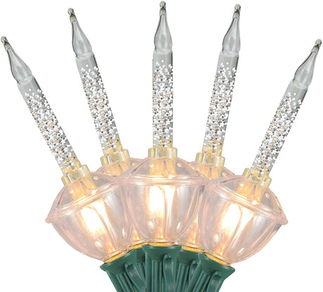 Clear and pure white bubble lights on a green wire.