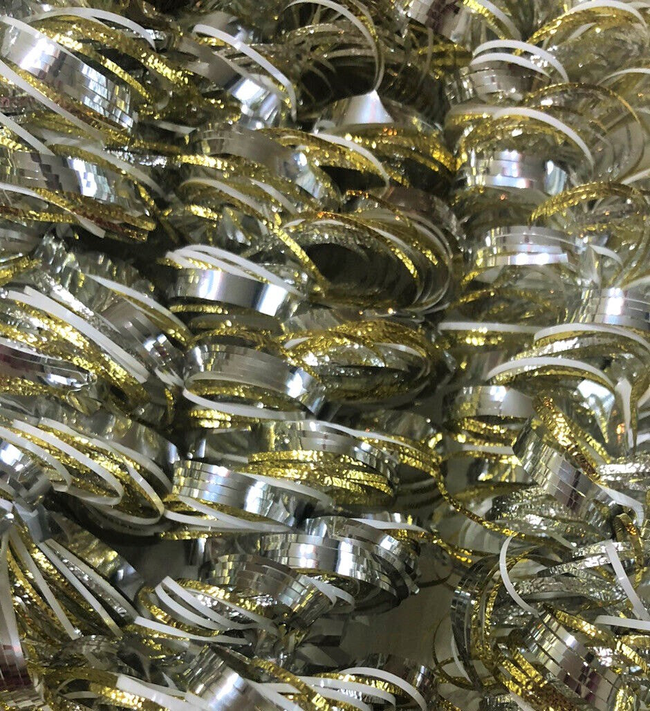 Gold, silver and white decorating tinsel.