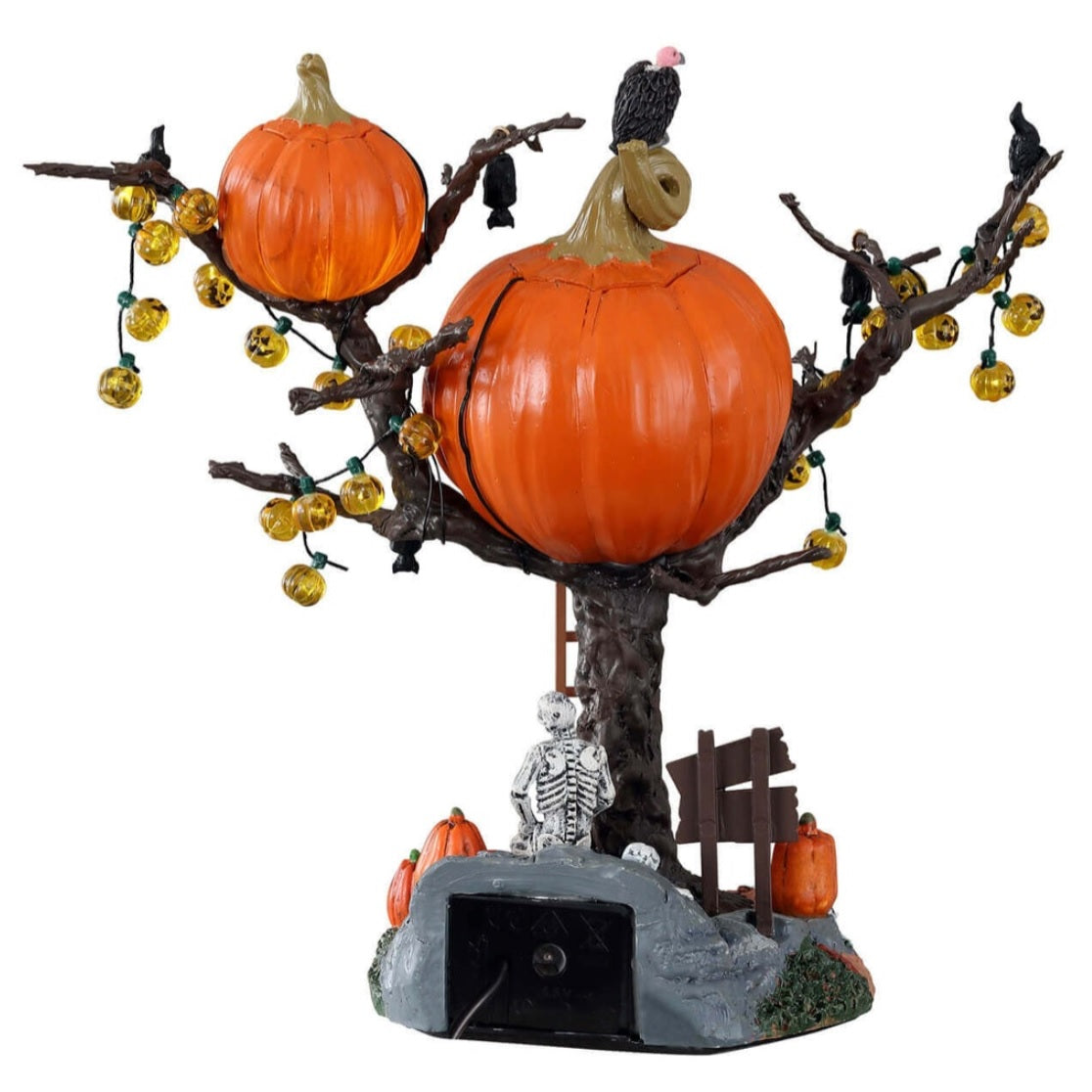 Polyresin village accent for a Lemax display. Designed to look like a treehouse made out of carved pumpkins. There are pumpkin lights, bats and black crows hanging from the branches. There's a vulture on the roof and a ladder leaning against the tree. There's a skeleton sitting underneath the treehouse among skulls, pumpkins and signs reading "BEWARE!" and "ENTER IF YOU DARE!"
