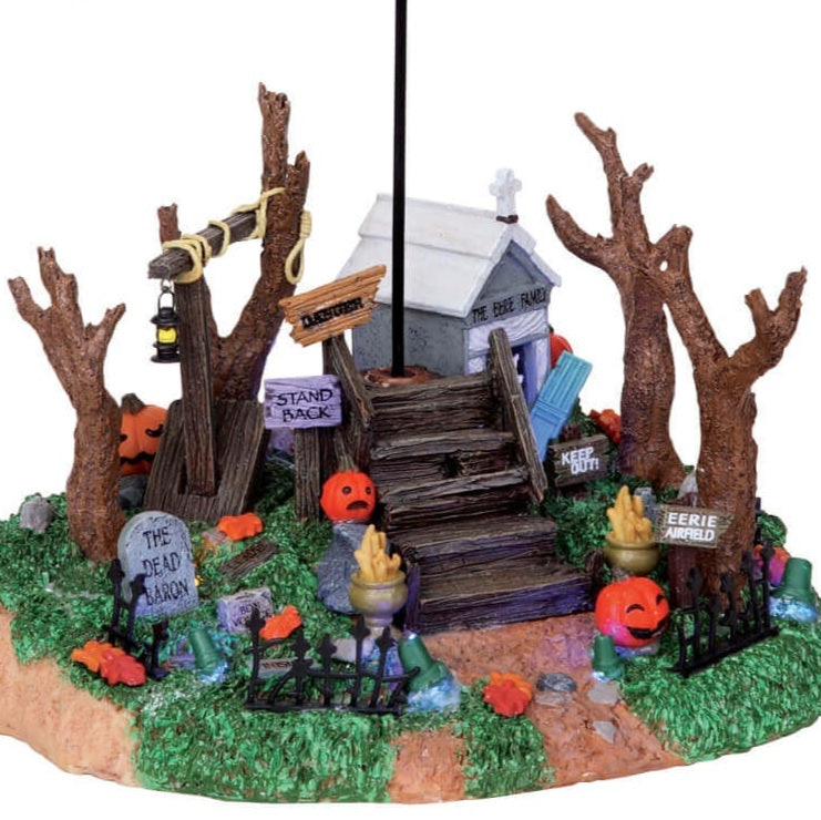 Polyresin village accent for a Lemax display. Designed to look like a blimp flying over a small house near a graveyard.