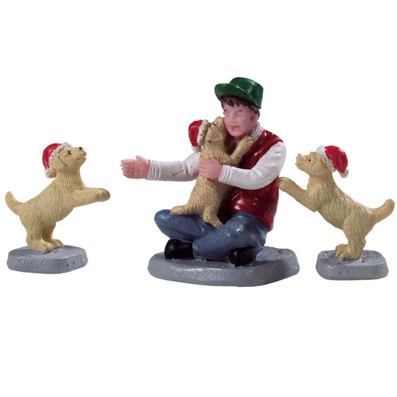 Polyresin figurines for a Lemax display. Designed to look like a young boy being greeted by three golden retriever puppies wearing Santa hats.