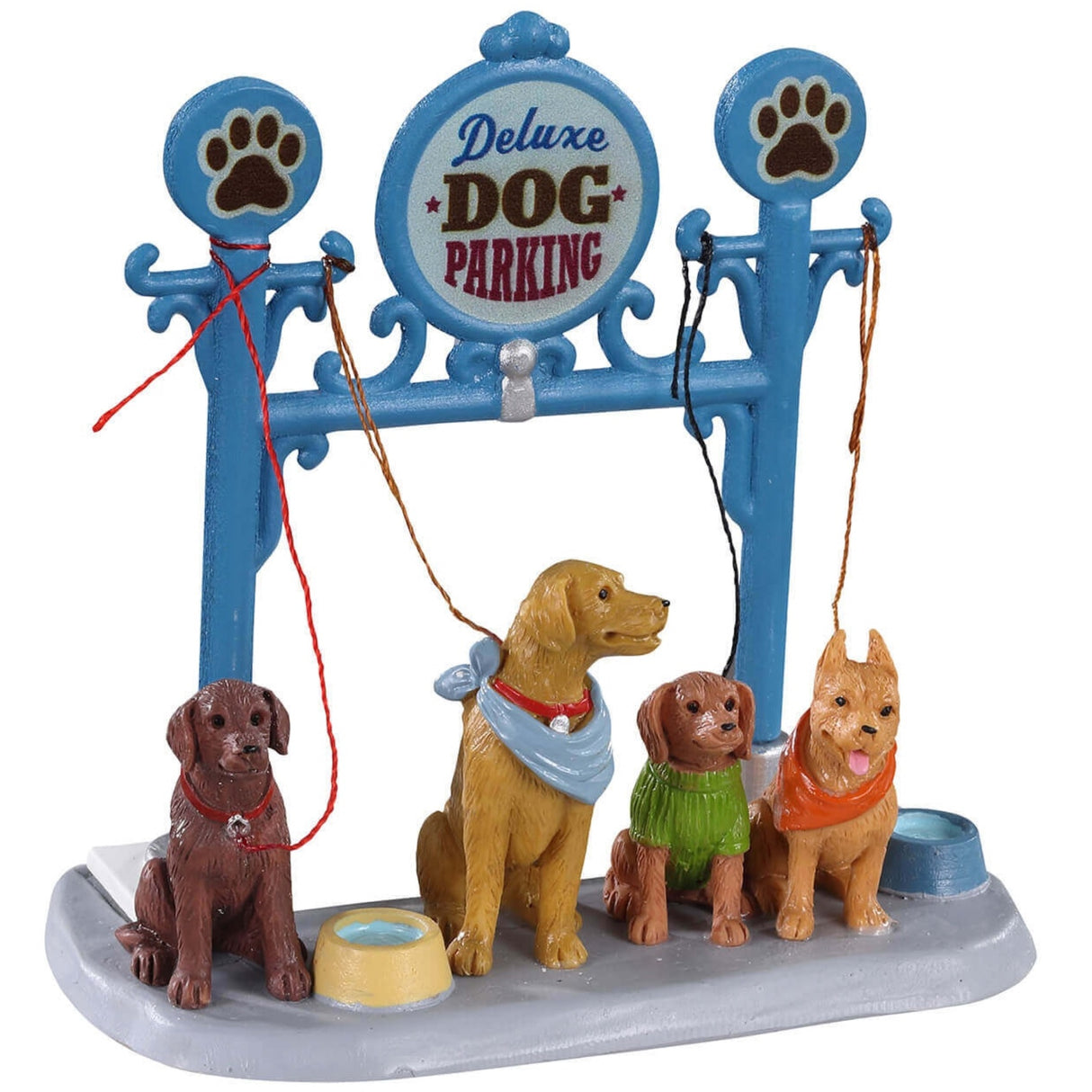 Polyresin figure for a Lemax display. Designed to look like a blue station for dogs to be tied up while their owners shop. The sign reads "Deluxe Dog Parking" and there are four dogs waiting patiently for their owners to return. There are two bowls of water on the ground.