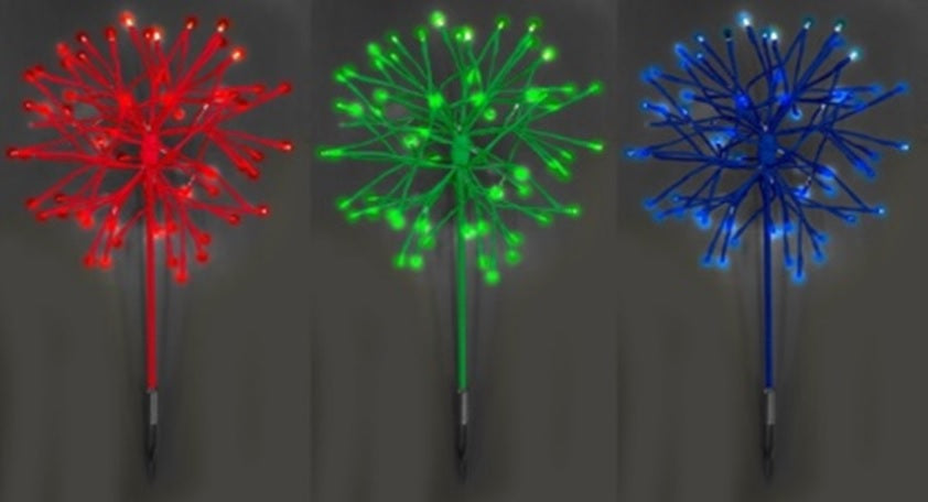 LED snowburst decorations. One is red, one is green and one is blue.