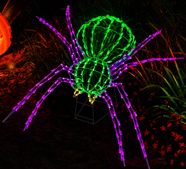 Twinkling LED outdoor decoration for Halloween. Shaped like a giant green and purple spider.