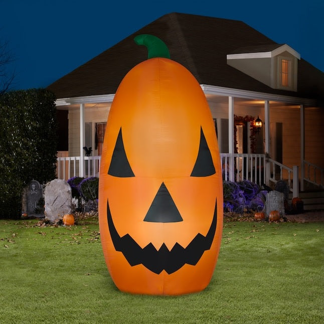 Very large, very bright inflatable shaped like a jack-o-lantern.