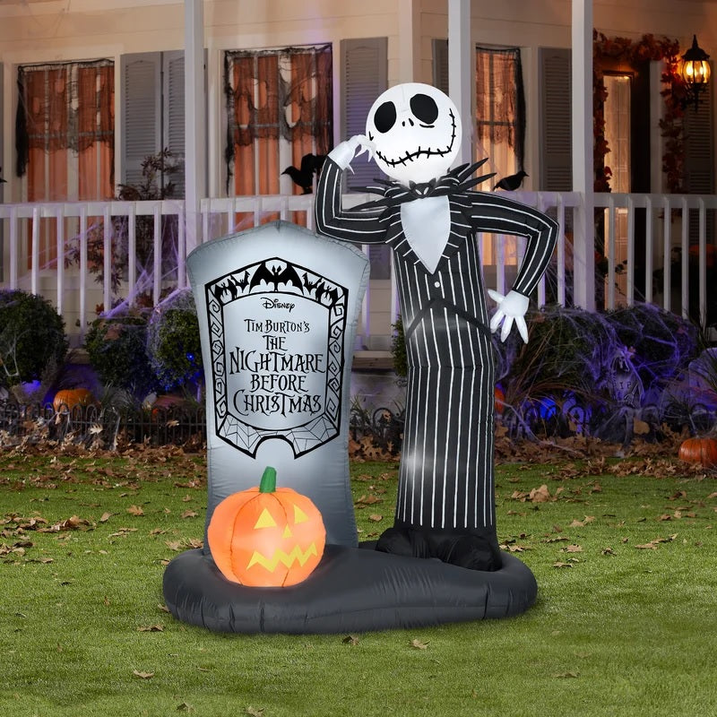 This image shows a Jack Skellington Inflatable in front of a house that's decorated for Halloween.