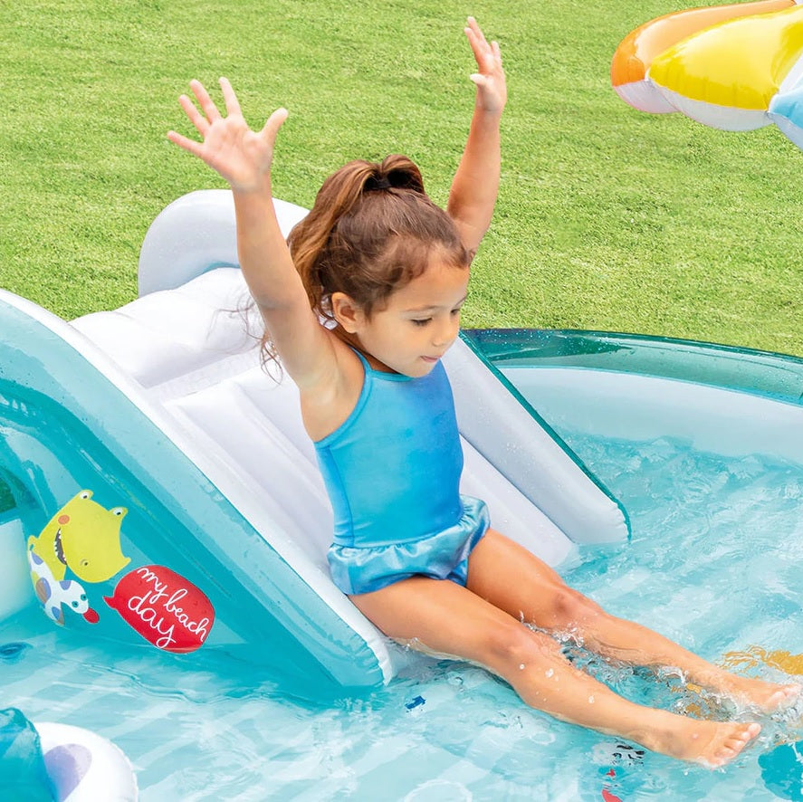 Inflatable kiddie pool features a slide, sprinklers, bucket and floatie. There's also a gator that sprays water.