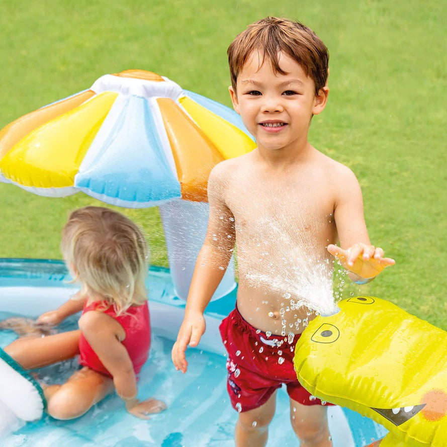 Inflatable kiddie pool features a slide, sprinklers, bucket and floatie. There's also a gator that sprays water.