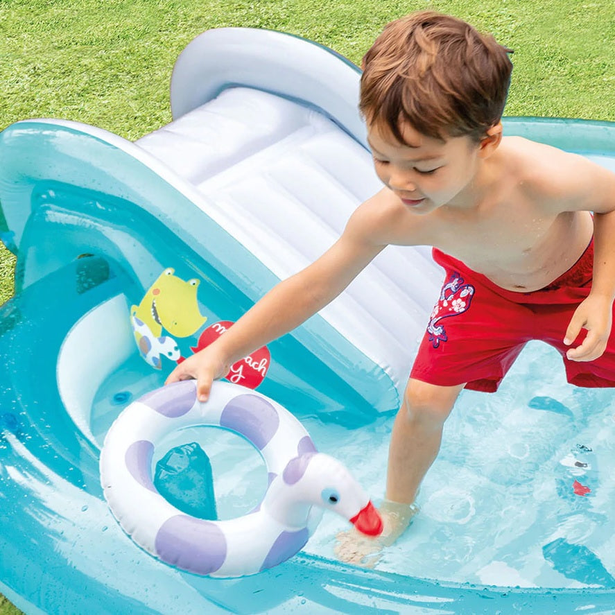 Inflatable kiddie pool features a slide, sprinklers, bucket and floatie. There's also a gator that sprays water.