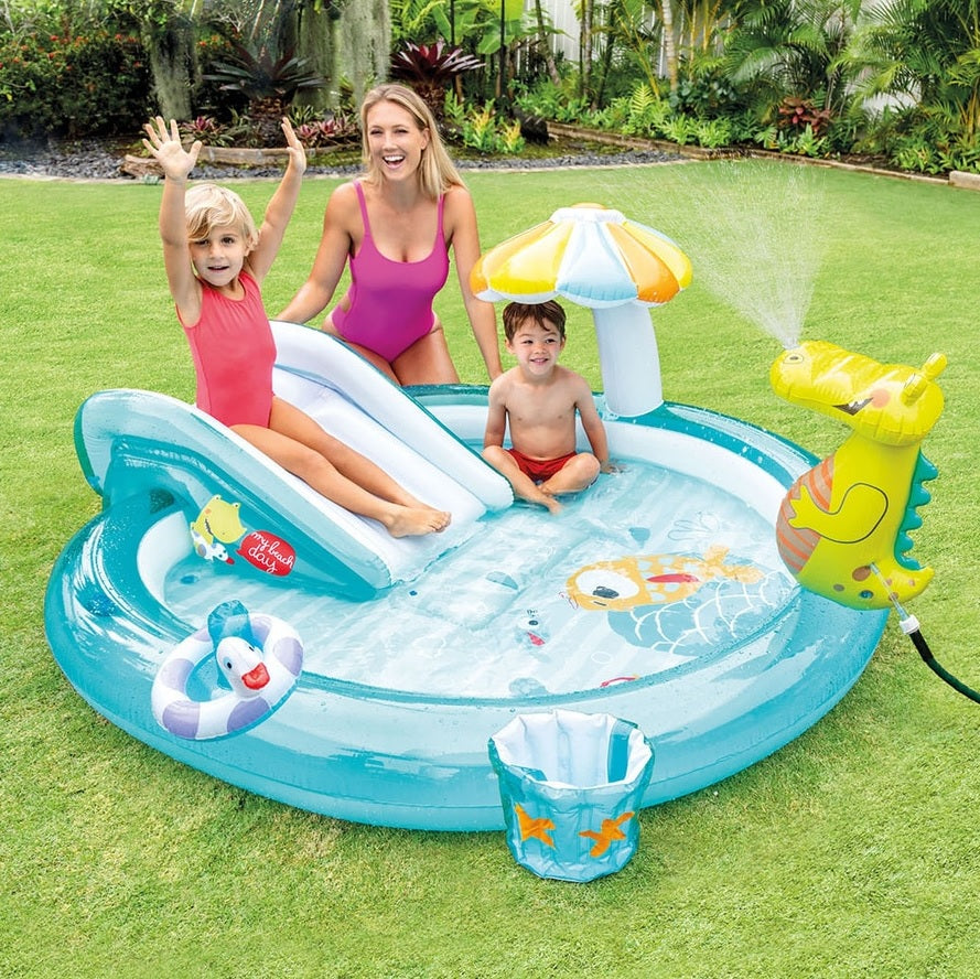 Inflatable kiddie pool features a slide, sprinklers, bucket and floatie. There's also a gator that sprays water.