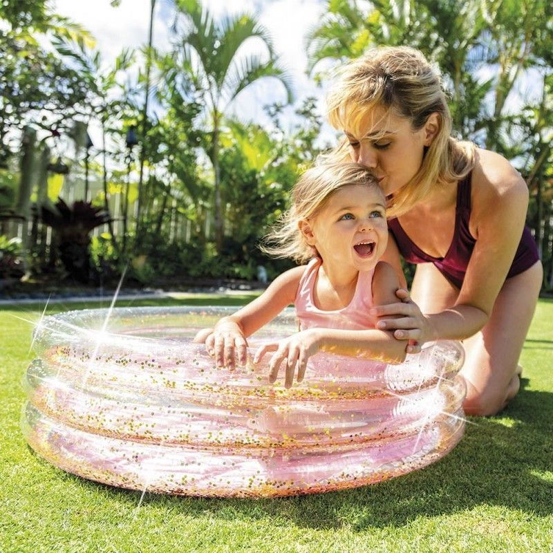 Pink and glittery mini inflatable kid's pool.