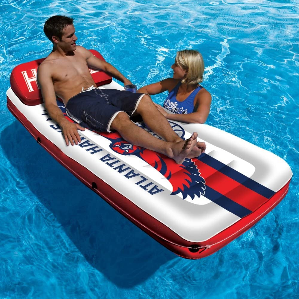 Pool mattress with Atlanta Hawks logos on it.