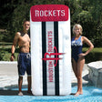 Pool mattress with Houston Rockets logos on it.