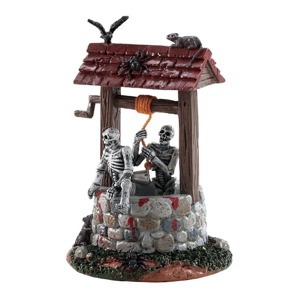 Polyresin figurine for a Lemax display. Designed to look like a stone water well. There's a crow, a spider and a rat on the roof. There are two skeletons climbing out of the well.
