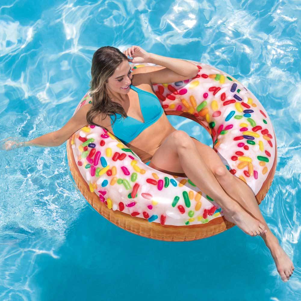 Inflatable inner tube designed to look like a donut with frosting and multi-colored sprinkles.