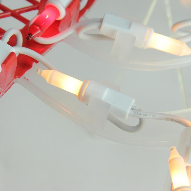 Lighted silhouette decoration shaped like baby Cupid holding a heart.