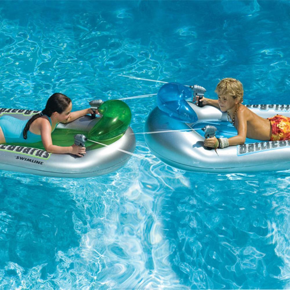Two pool floats with squirt guns attached to them.